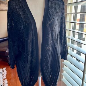 Maurice’s black cardigan.